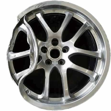 Bent alloy wheel before repair